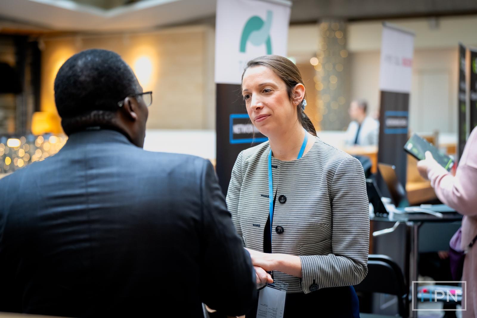 Our CEO engaging with a client at a healthcare industry event